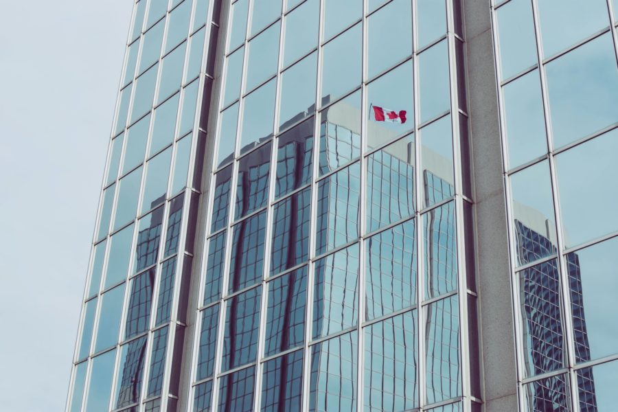 Canadian flag reflected on building